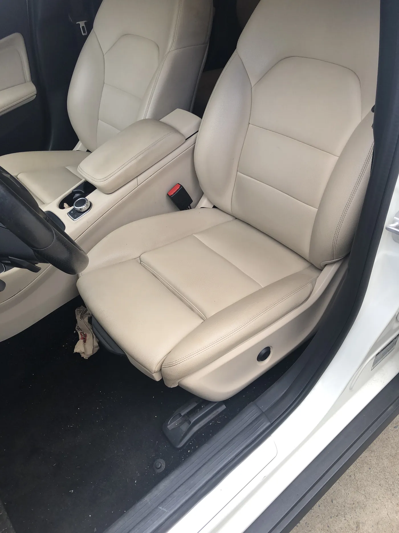 A cream leather front seat fitted in the car