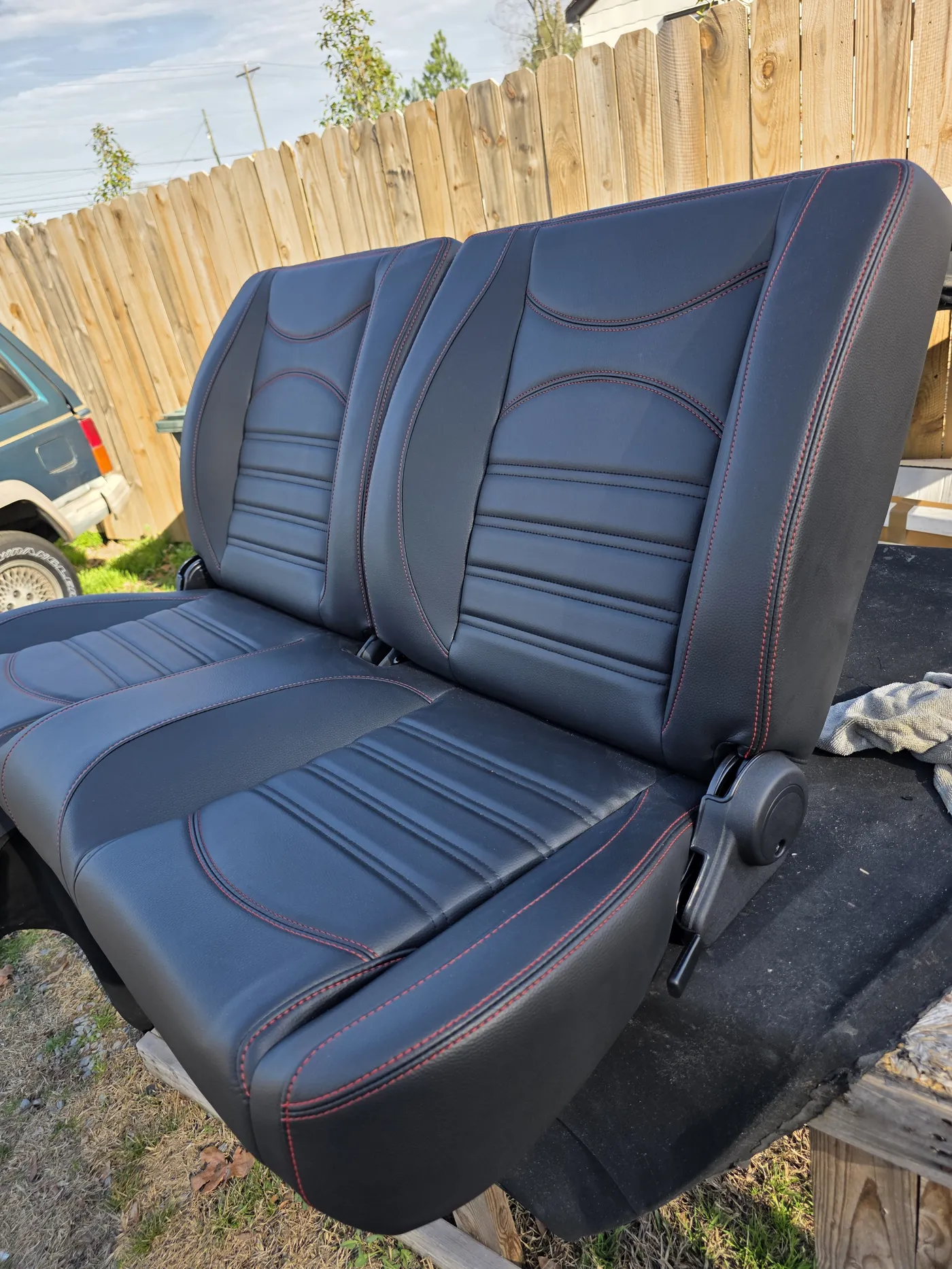 Bench seat in black with blue accent panels