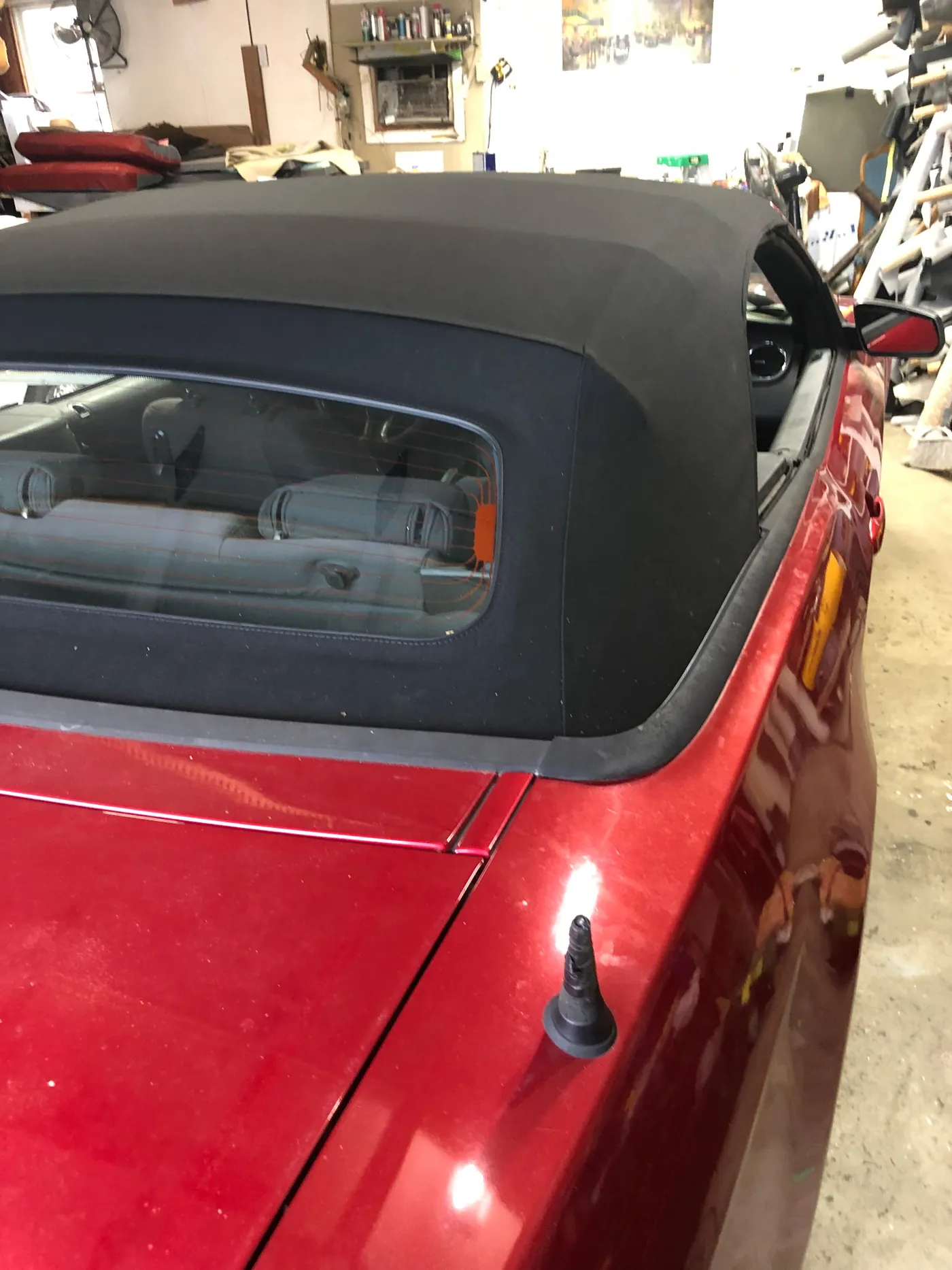 A new black top fitted, seen from the rear quarter