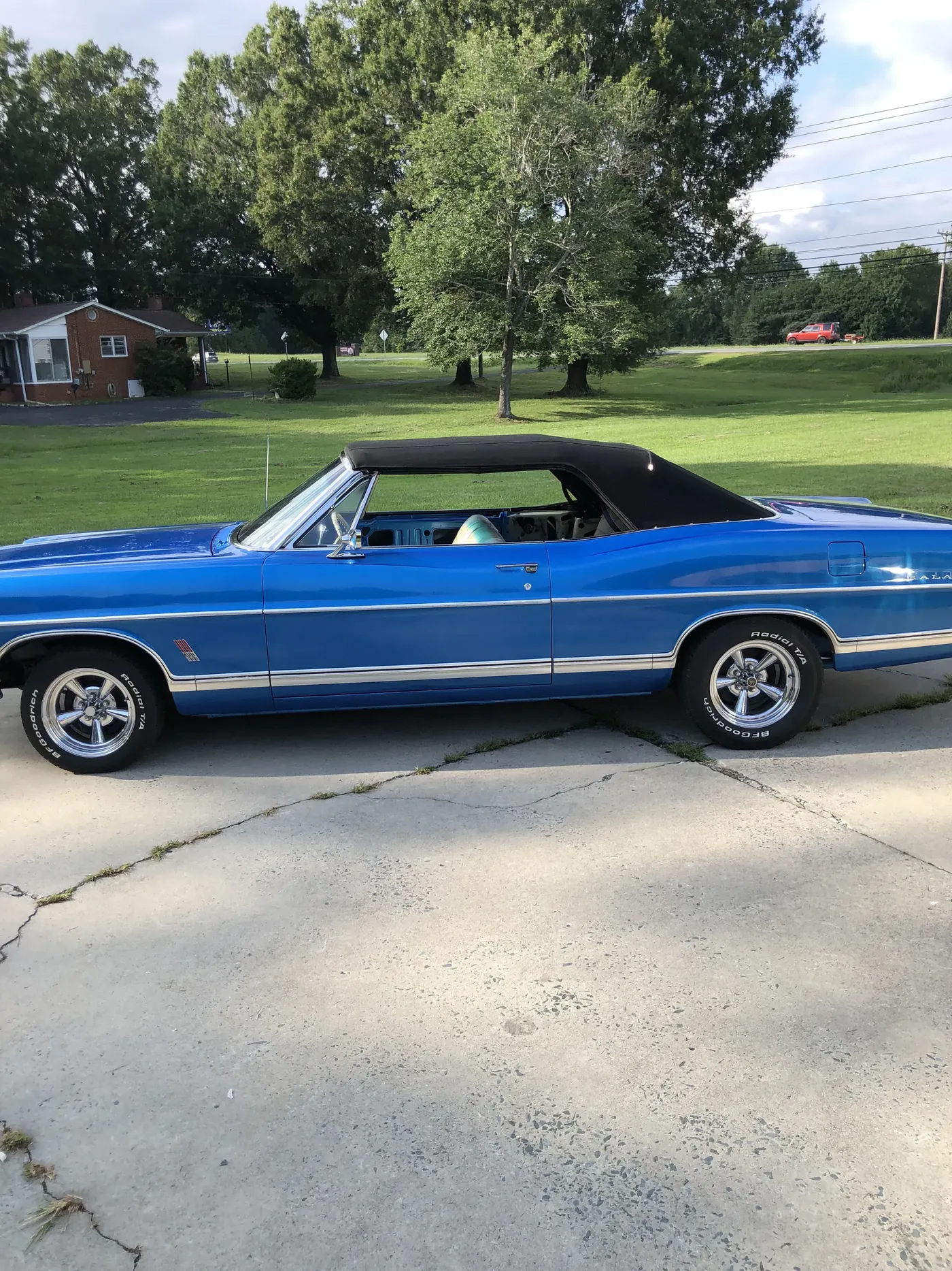 The same blue classic back outside, finished, with the top down