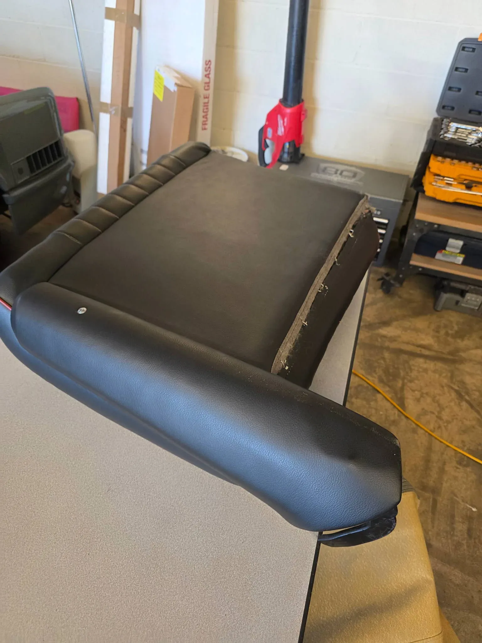 Cushion and armrest, trimmed on the bench