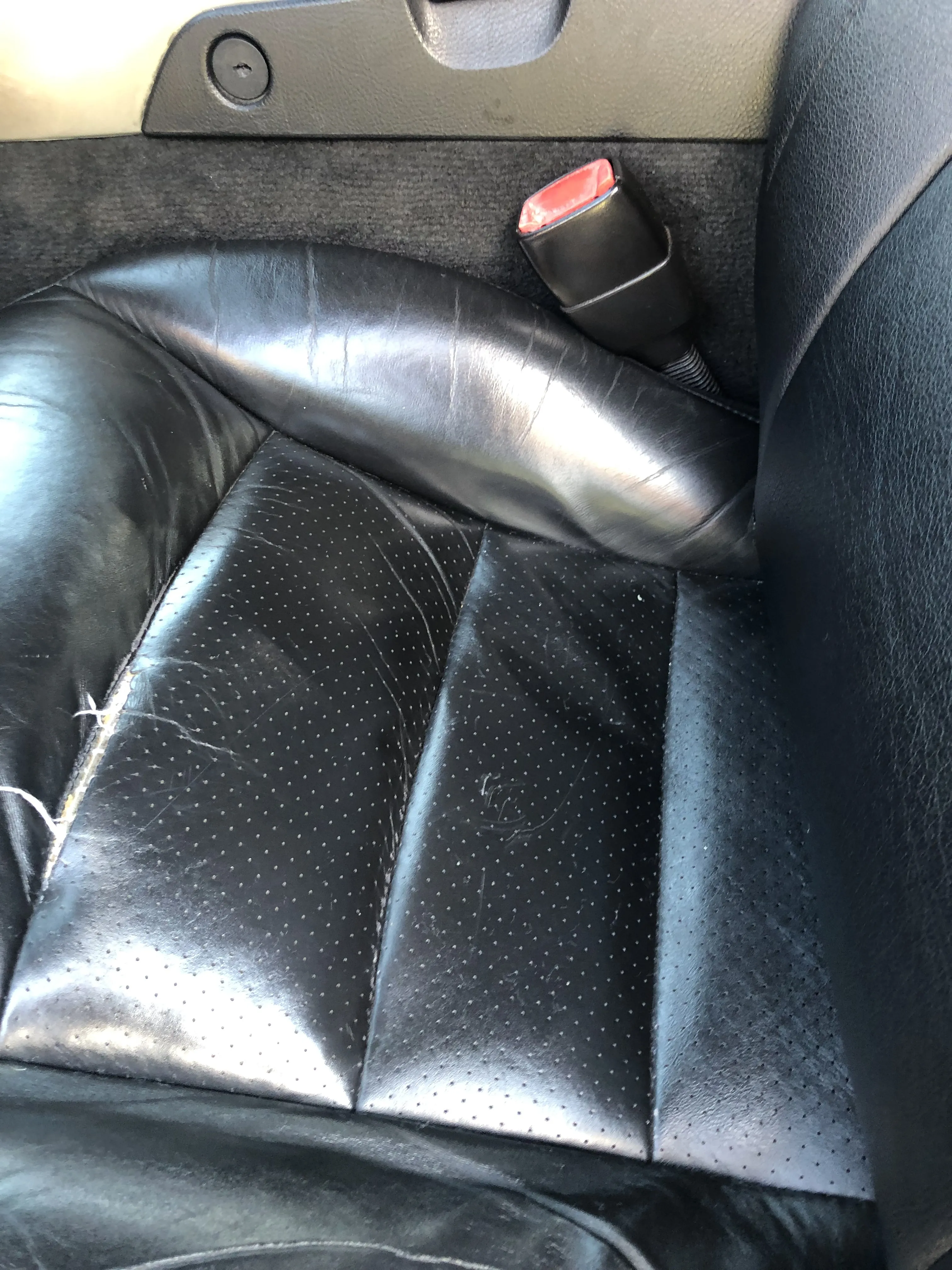 After — black perforated leather seat