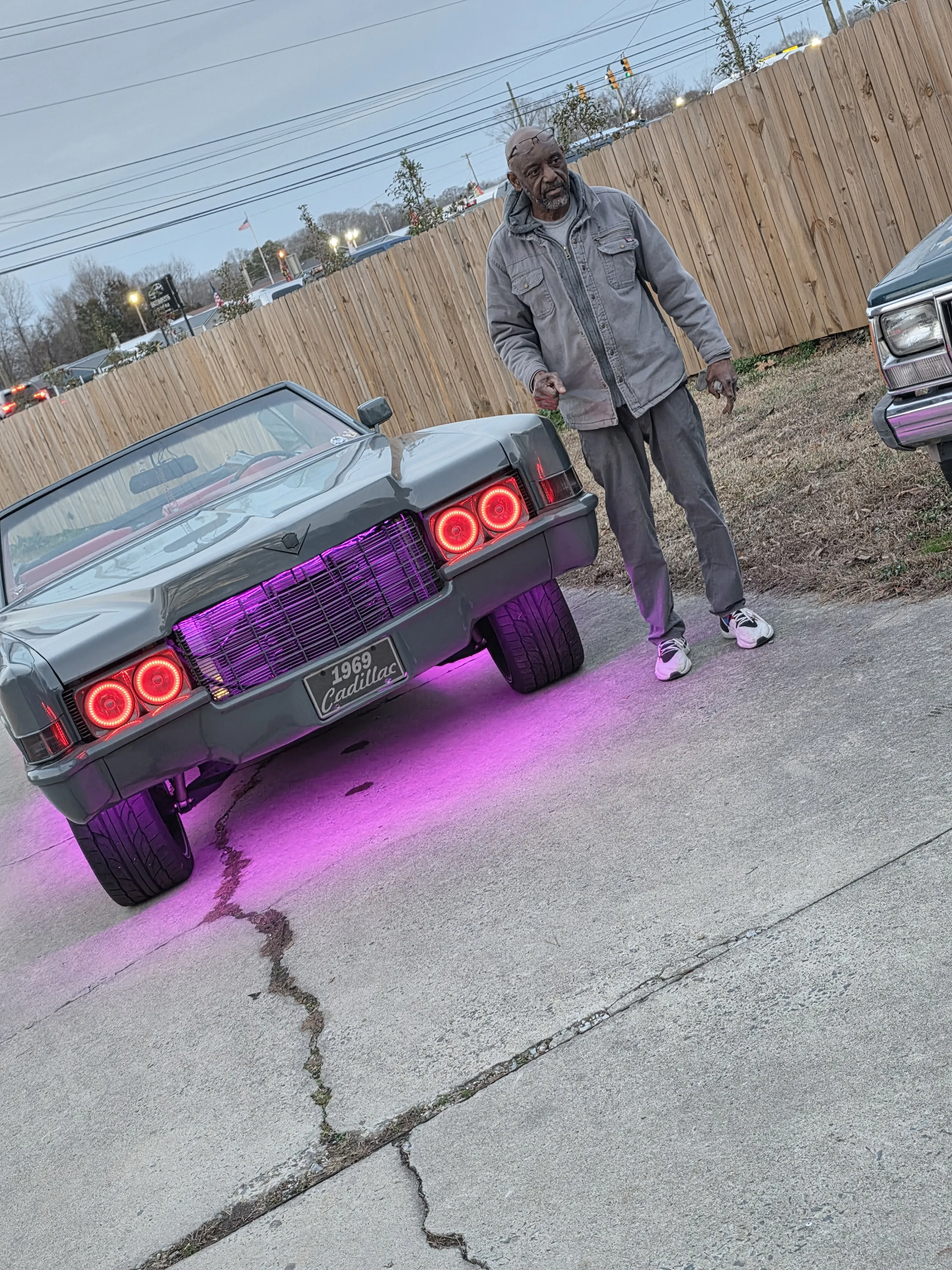 Person beside the cadillac