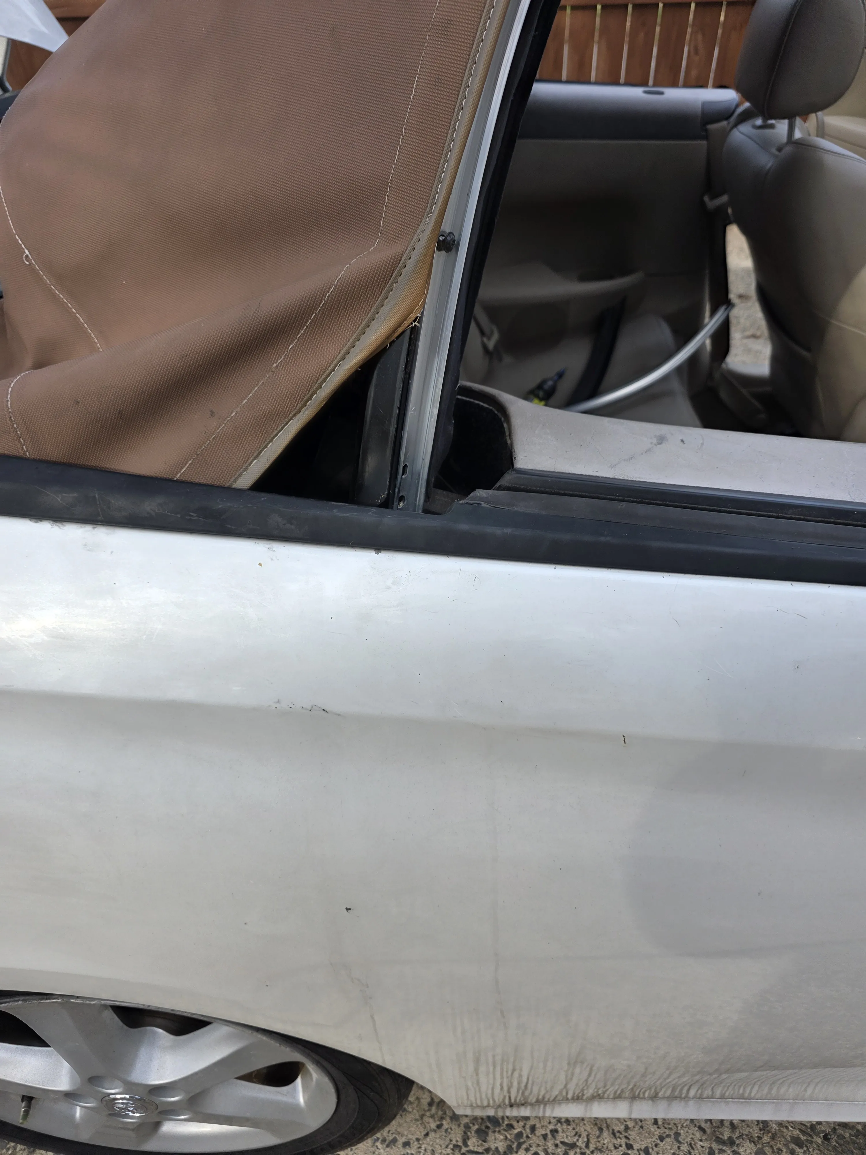 After — brown top on white car