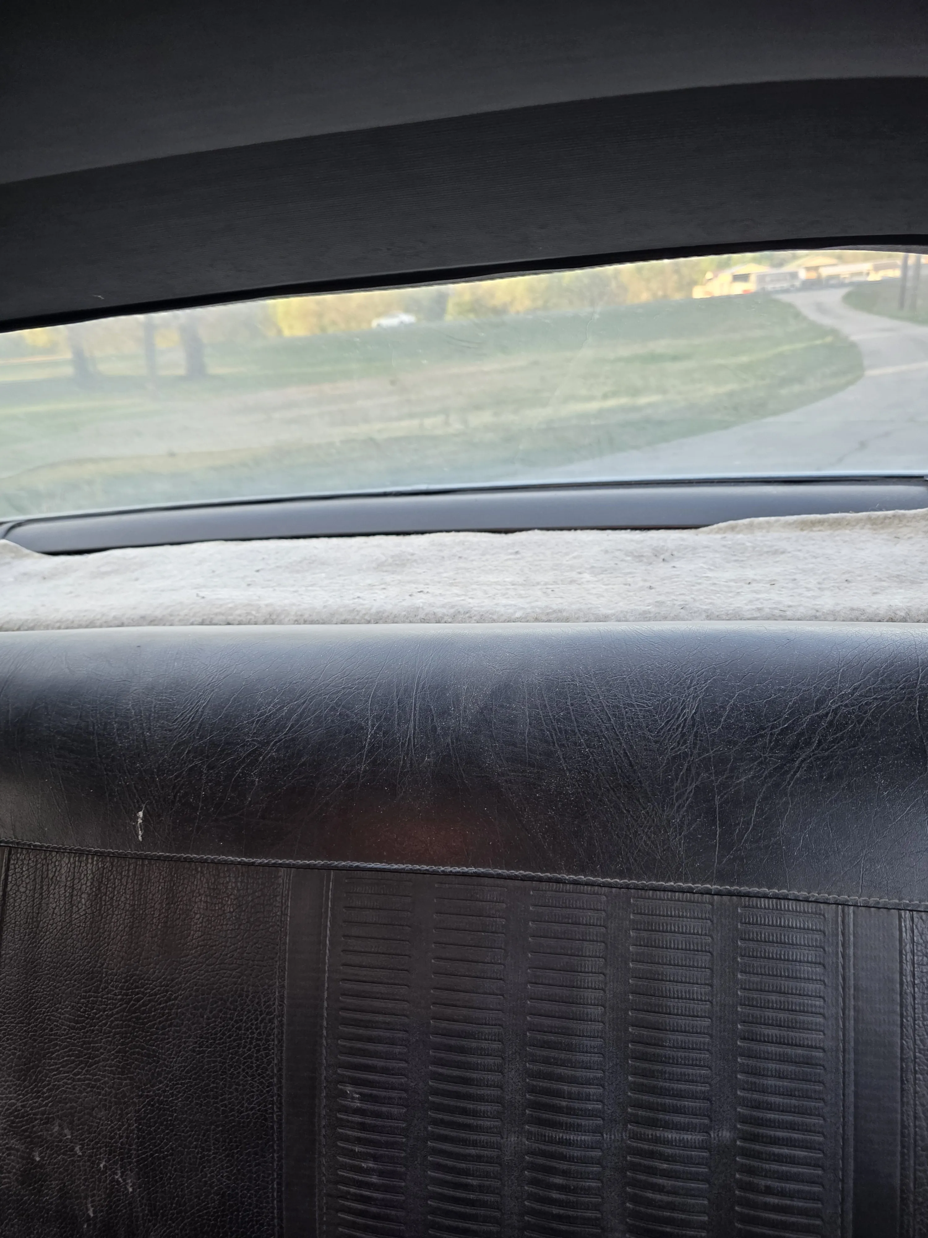 Before — worn vinyl bench