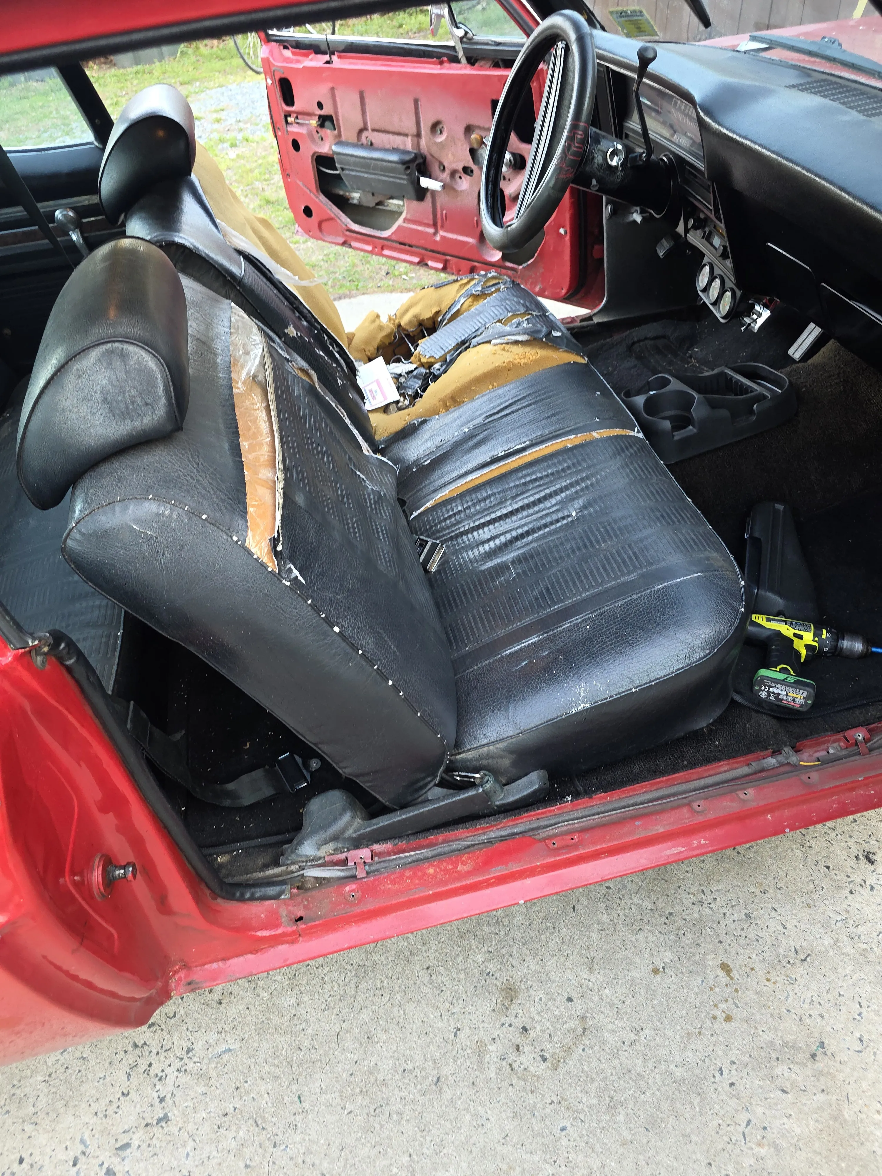 Before — red car seat torn