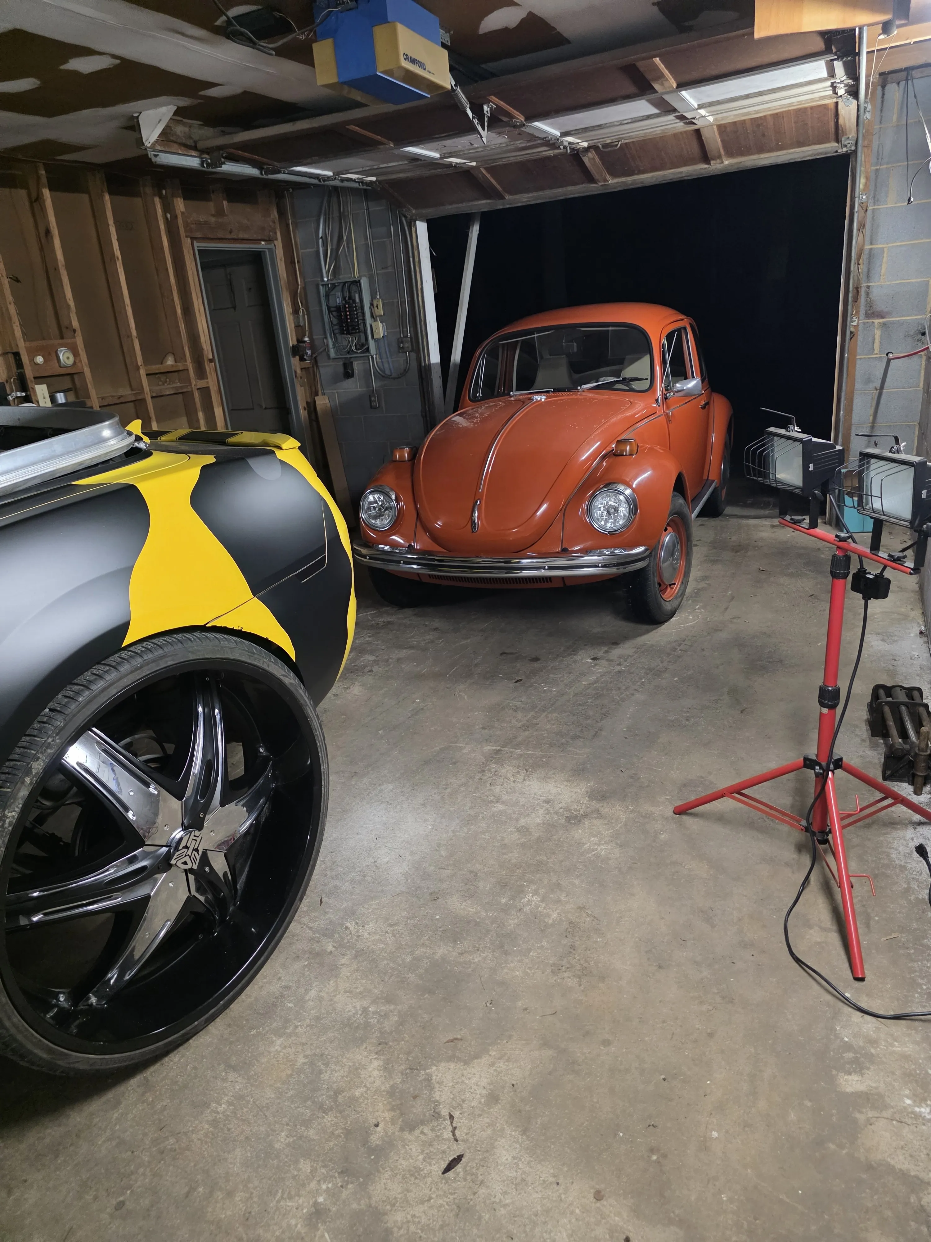 Beetle and yellow car