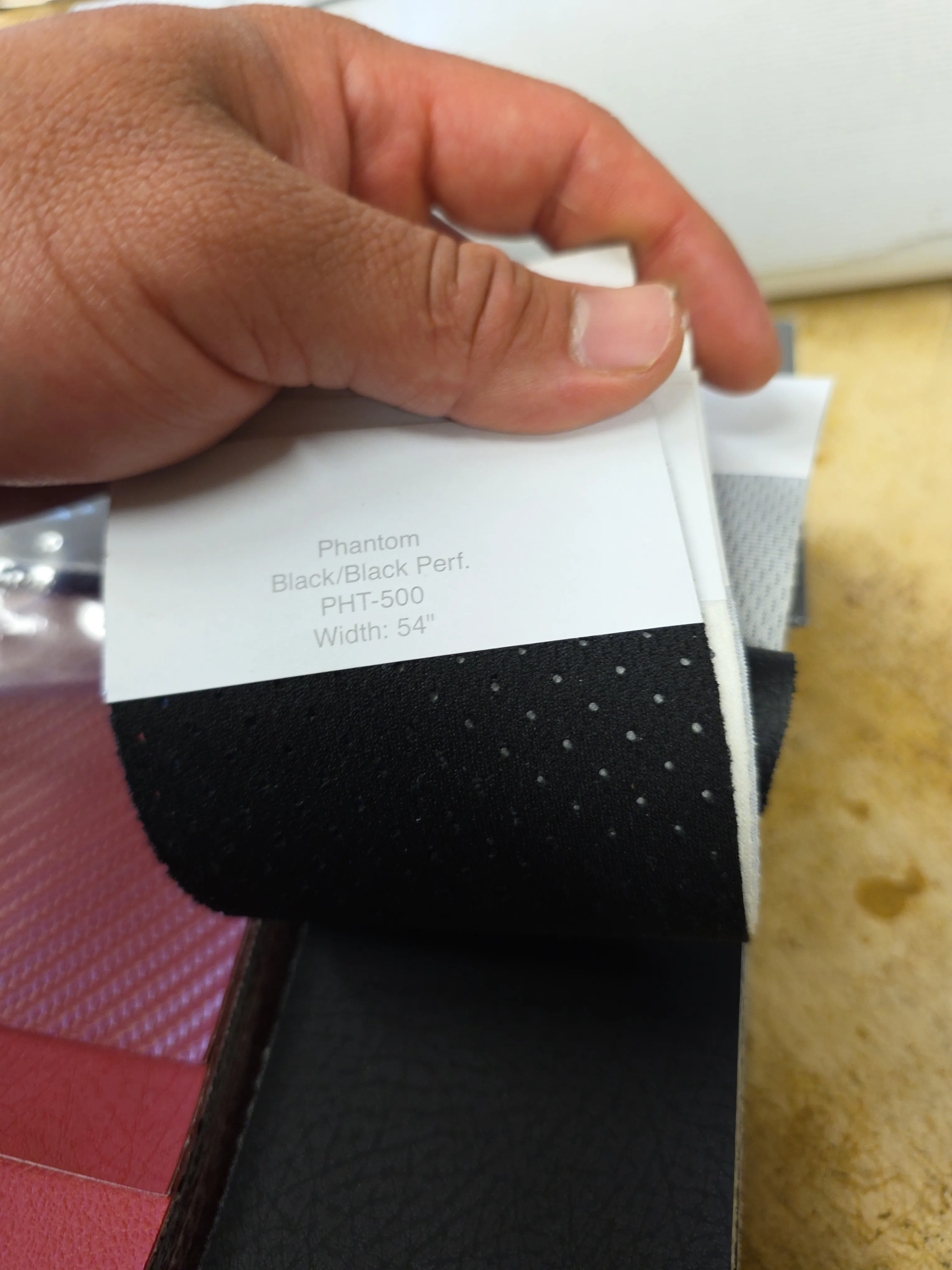 Hand holding vinyl sample